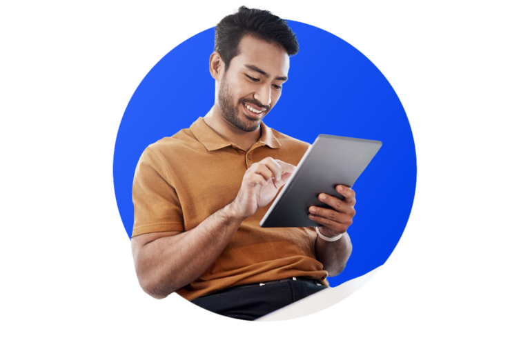 man working on a tablet with a blue circle behind him