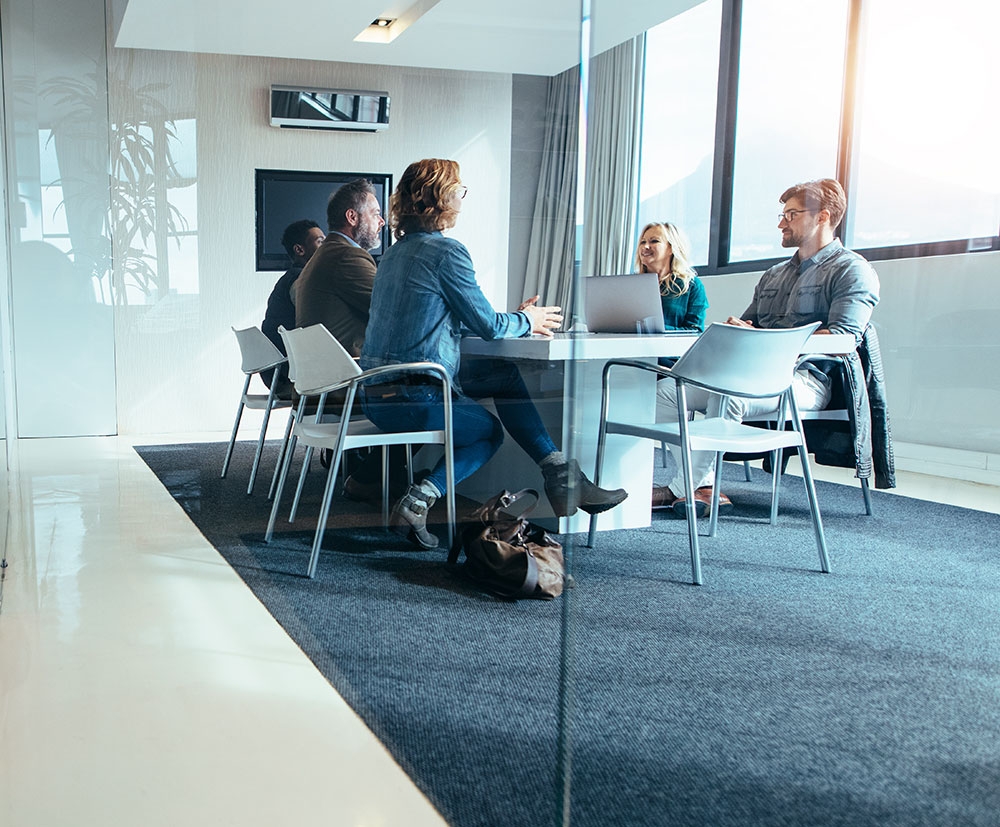 Group of diverse professionals having a meeting in a conference room