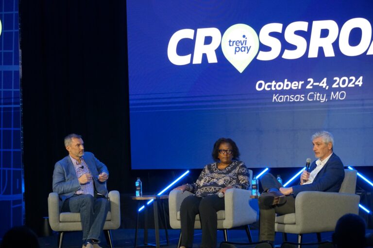 Rosilyn Richey of Viking Cruises and James Norfor of b2buy on stage at Crossroads.